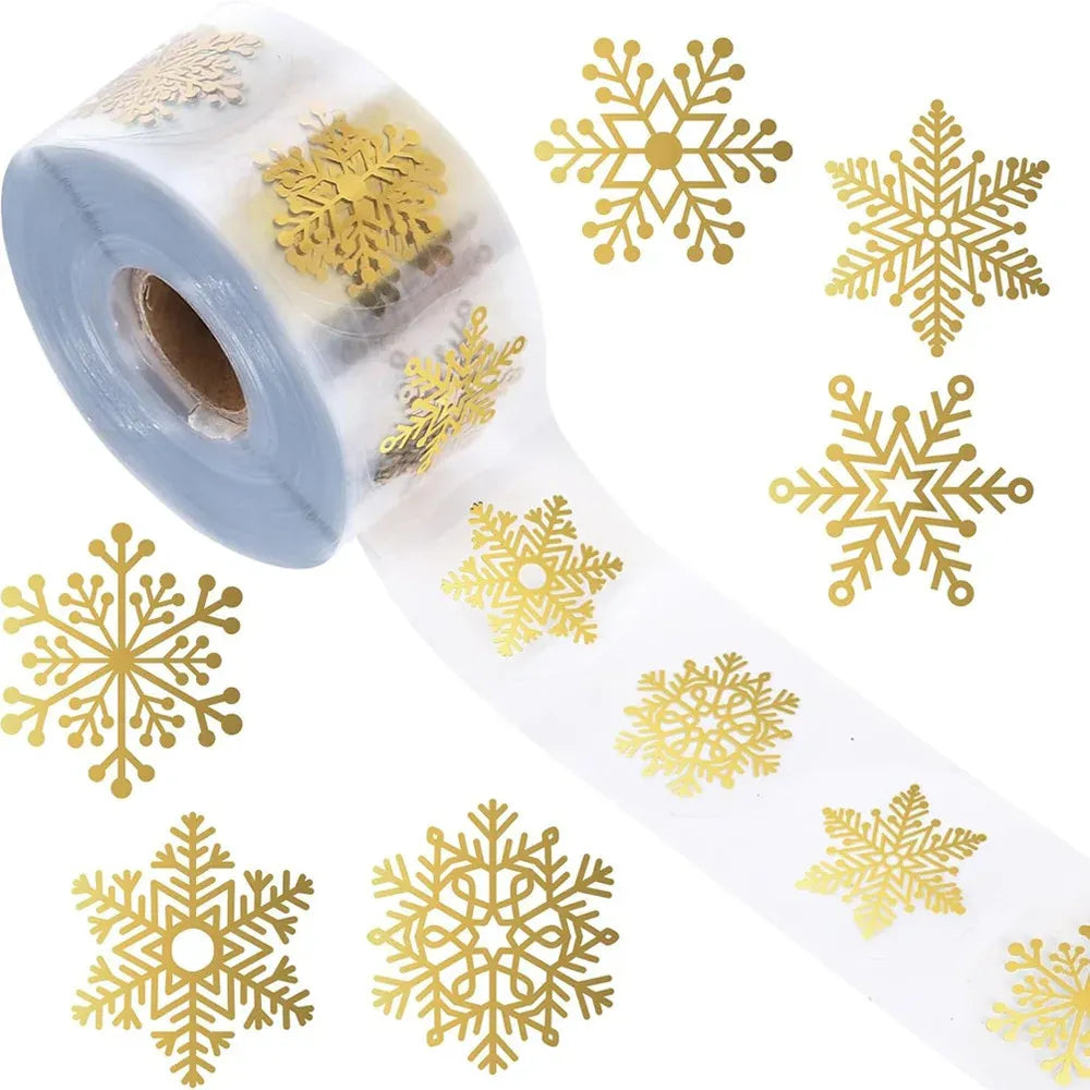 Transparent roll of gold foil snowflake circle stickers with visible tape edge
