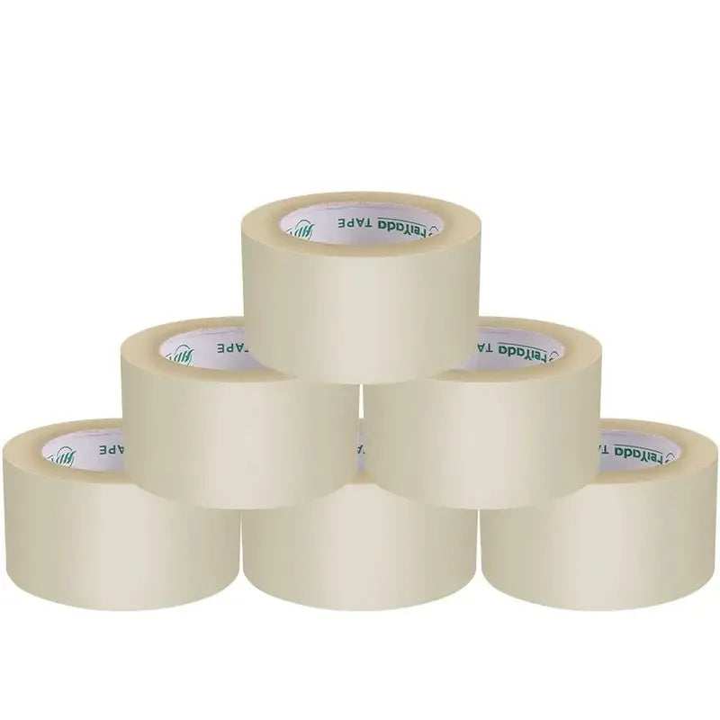 Clear white packing tape rolls stacked, pressure-sensitive acrylic adhesive