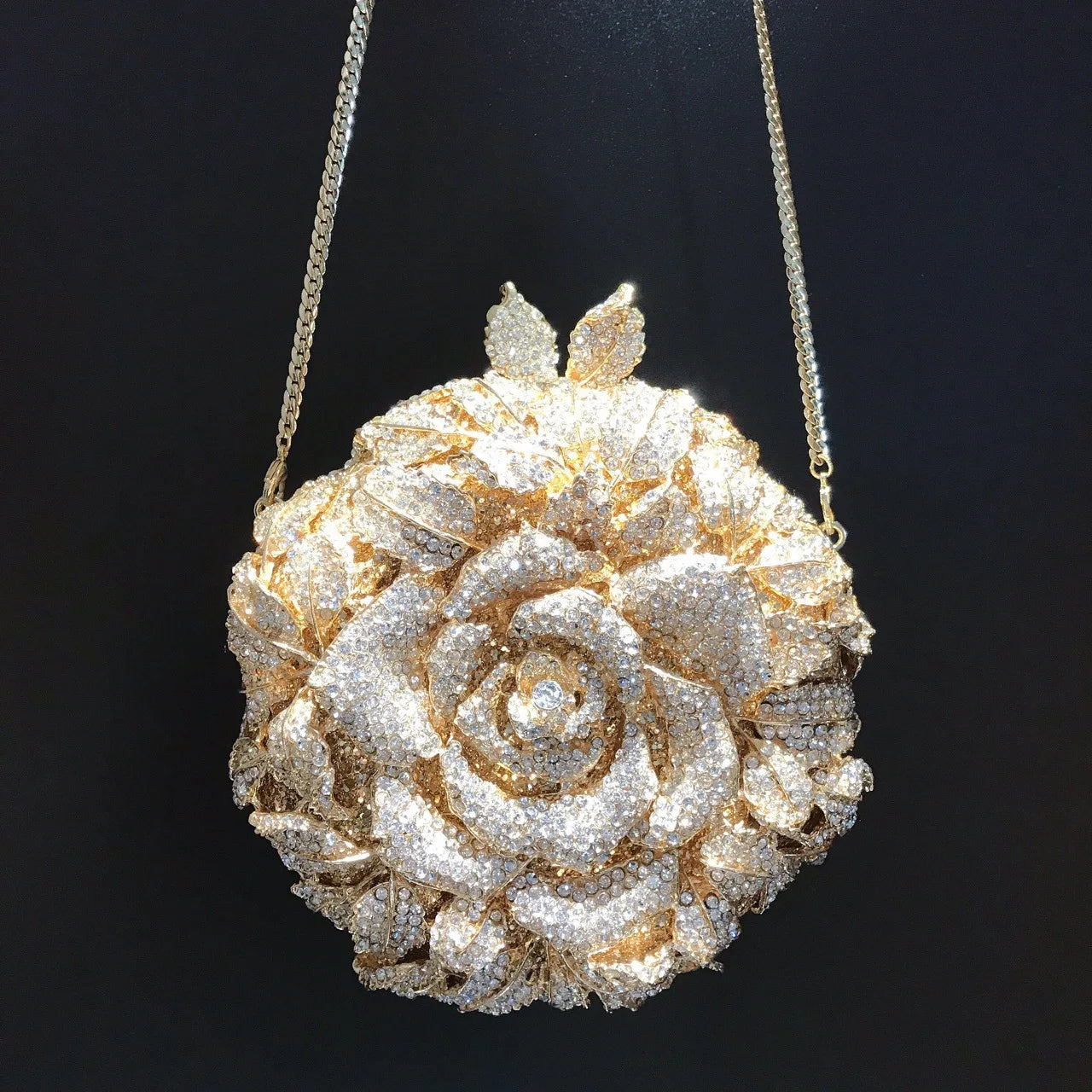 Gold flower designer clutch bag with sparkling rhinestones, perfect as an elegant wedding or evening handbag.