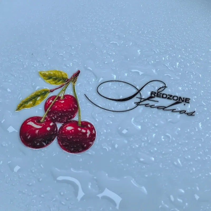 Vinyl die-cut cherry sticker cluster with red cherries, green leaves, and script