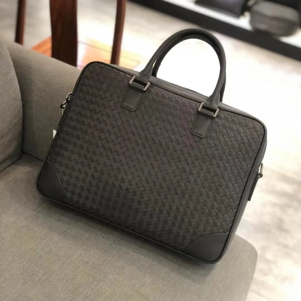 Luxury dark brown hand-woven leather 14-inch executive laptop briefcase for men with structured top handles.