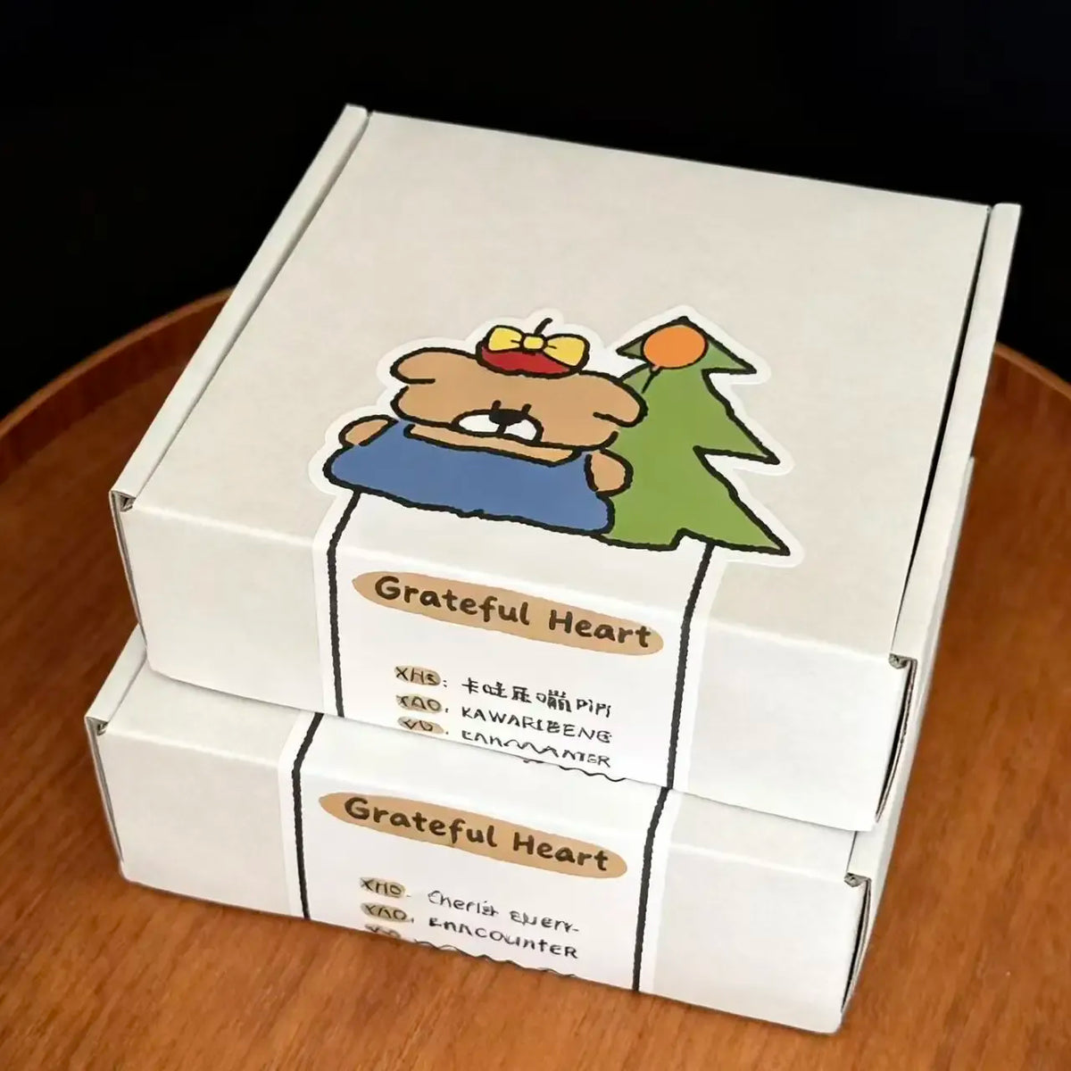 Grateful Heart paper box seal sticker with bear illustration and label text