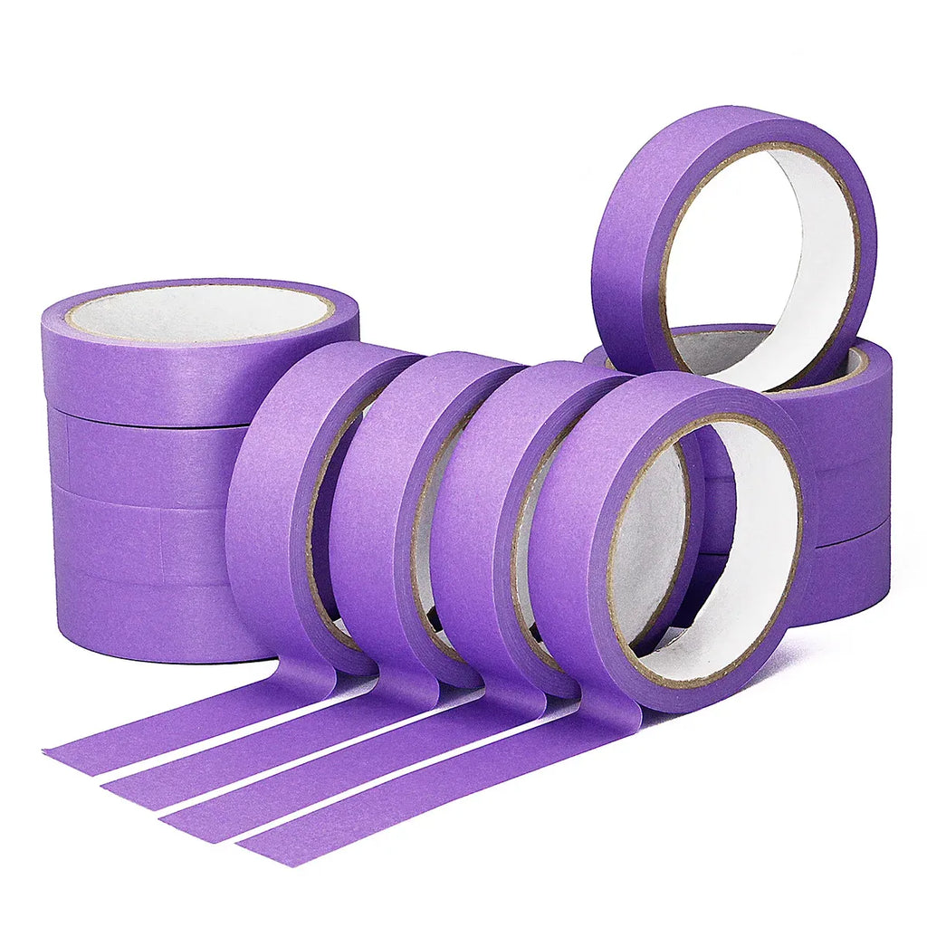 Purple masking tape rolls with several wraps and a strip extended outward.