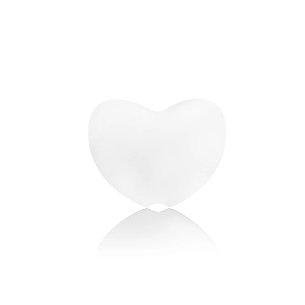 White heart-shaped silicone baby teething toy for soothing sore gums.