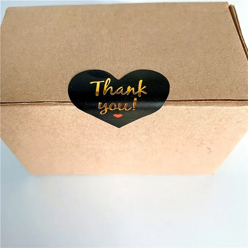 Black heart thank you adhesive seal sticker on kraft brown box