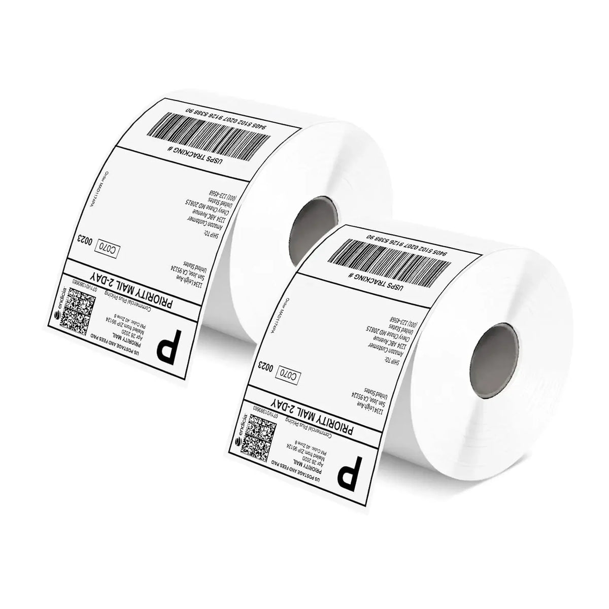 Two white label rolls with barcodes and address text labels, angled view