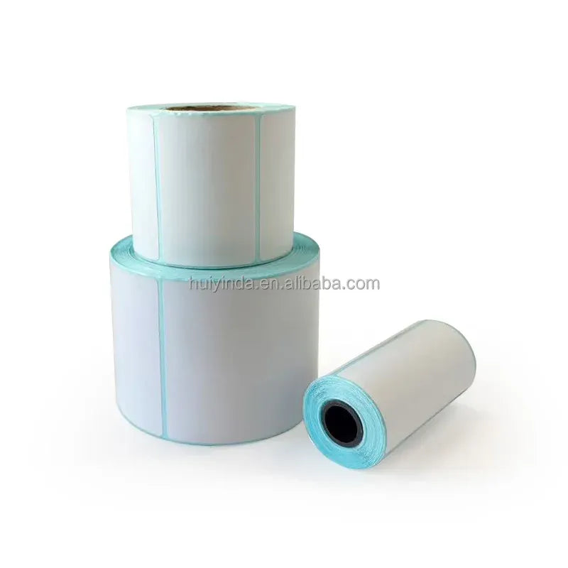 Thermal label rolls with white faces and teal core trim, one loose roll