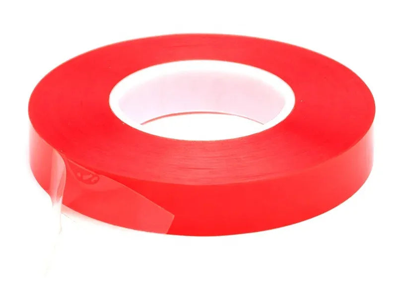 Red double-sided PET tape roll with visible inner adhesive liner
