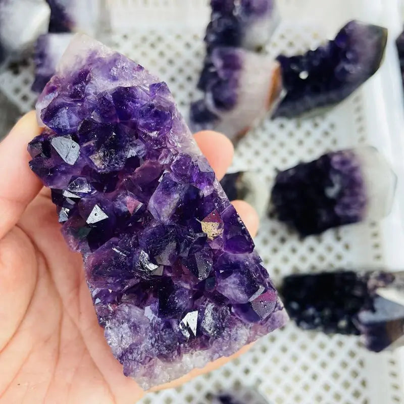 Purple amethyst druzy crystal cluster point with darker and lighter areas
