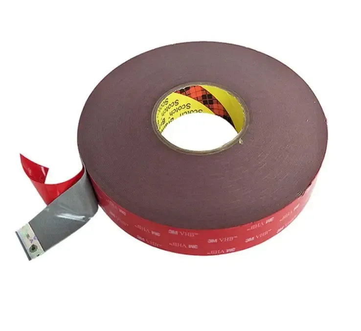 Brown double-sided acrylic foam tape roll with center core and red end strip