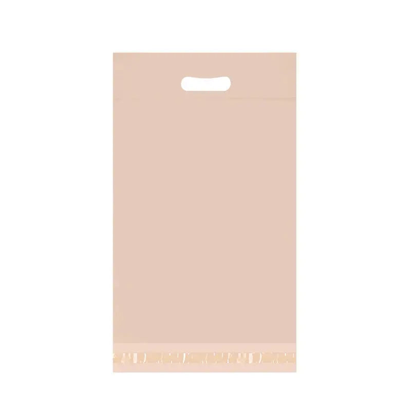 Beige poly mailer plastic mailing bag with handle cutout and sealed bottom