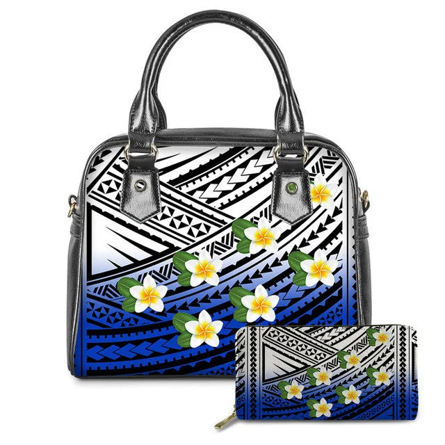Blue and white leather handbag and wallet set featuring Polynesian tribal patterns and colorful plumeria flower prints.