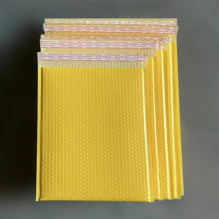 Waterproof padded bubble mailer bag, yellow, multiple stacked envelopes