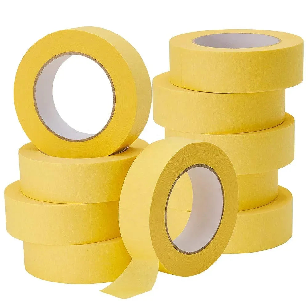 Assorted yellow masking tape rolls, paper-backed with visible core openings