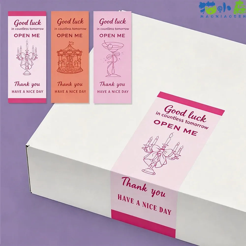 Rectangle seal stickers with “OPEN ME” and “Thank you” text on a sticker sheet
