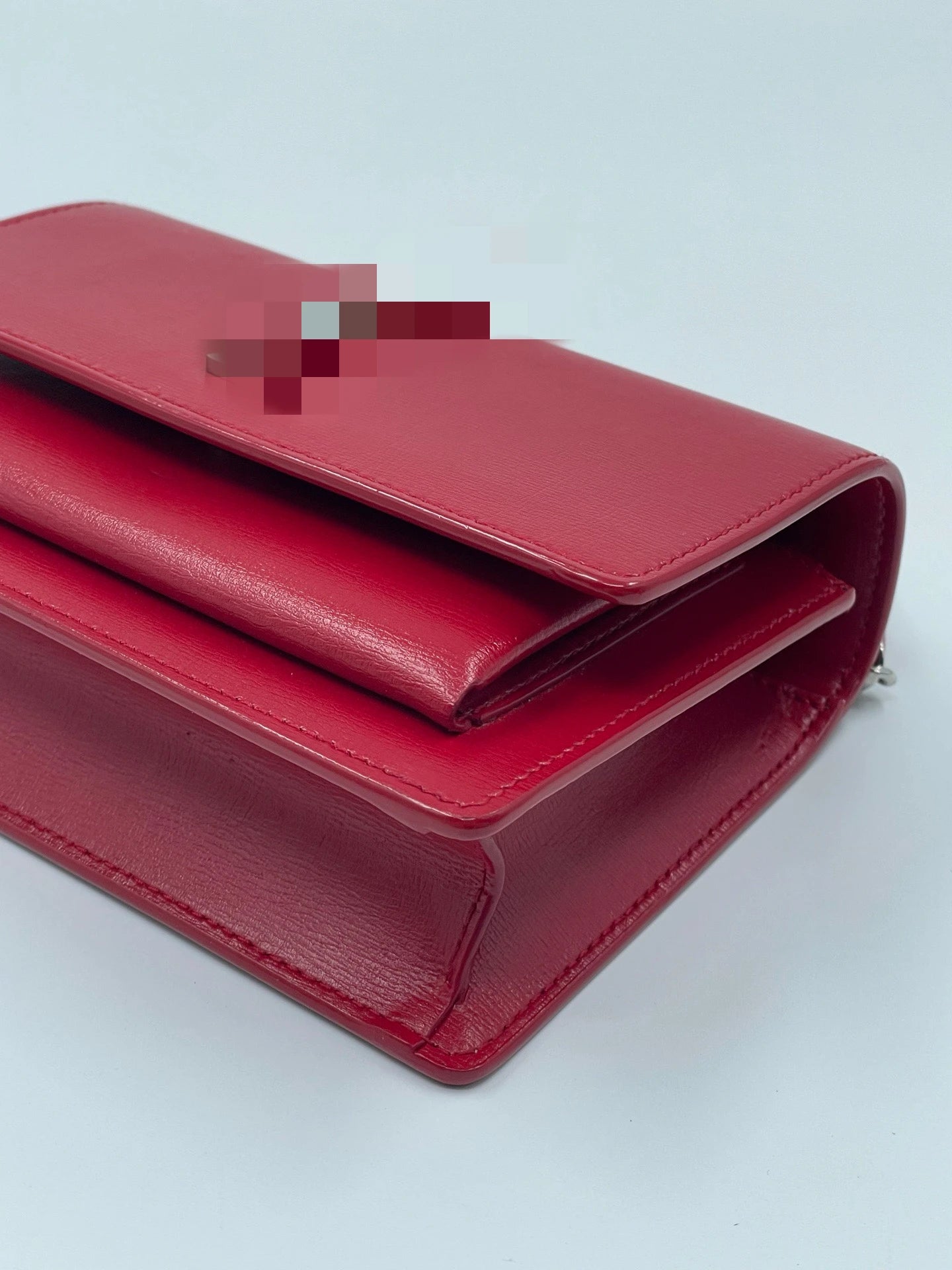 Luxury pre-owned red genuine leather designer crossbody bag with a flap closure and elegant structured silhouette.