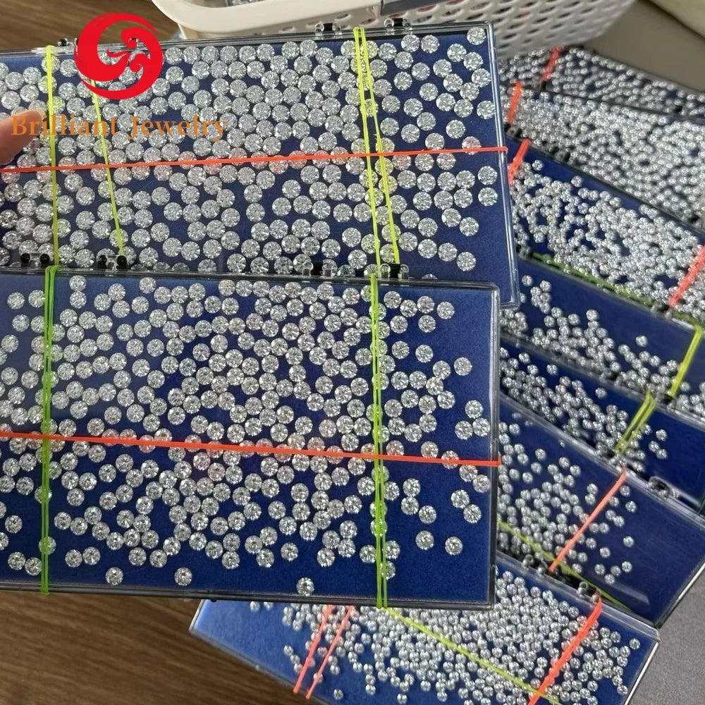 Bulk tray of round lab-grown diamonds arranged in grid sections