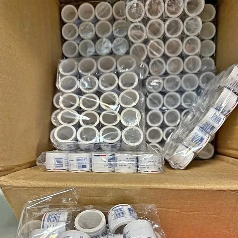 Roll of small round self-adhesive stamp pieces, packed and ready for letters