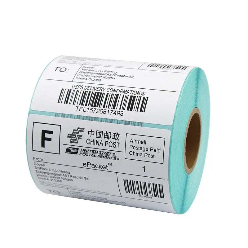 Roll of shipping label stickers with barcodes and teal backing edge