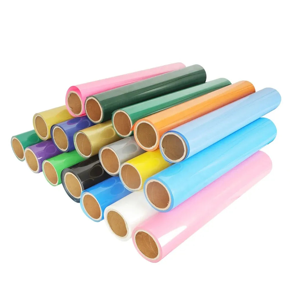 Assorted heat transfer vinyl rolls in pastel and bright colors, stacked together