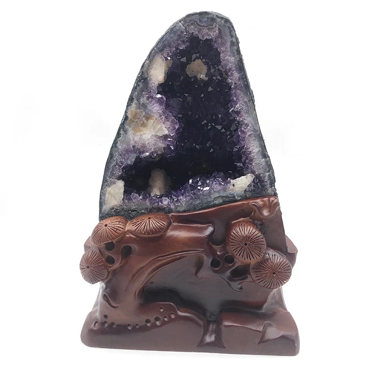 Tall purple amethyst geode decoration with sculpted brown base featuring round floral motifs
