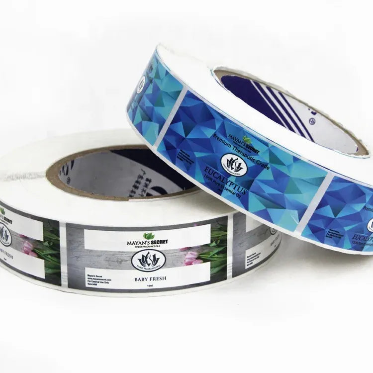 Glossy waterproof label sticker roll with blue patterned labels and handles