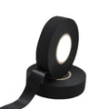 Black insulation tape roll with backing strip unwound and core end visible