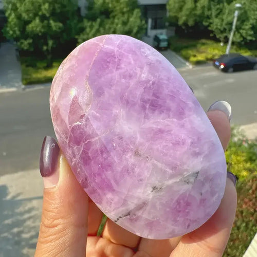 Natural purple kunzite palm stone, smooth polished oval with subtle light striations