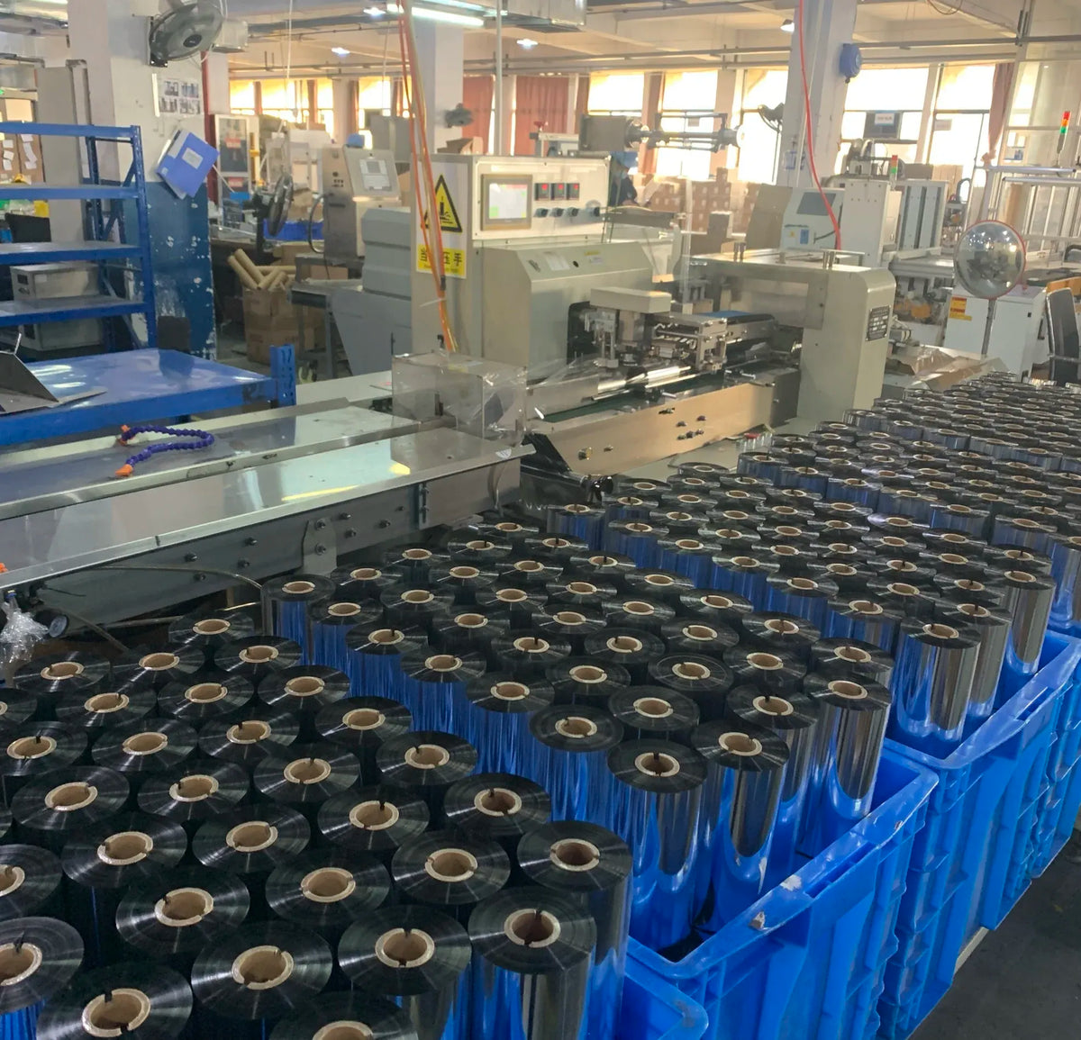 Wax thermal transfer ribbon spools lined up on an industrial machine