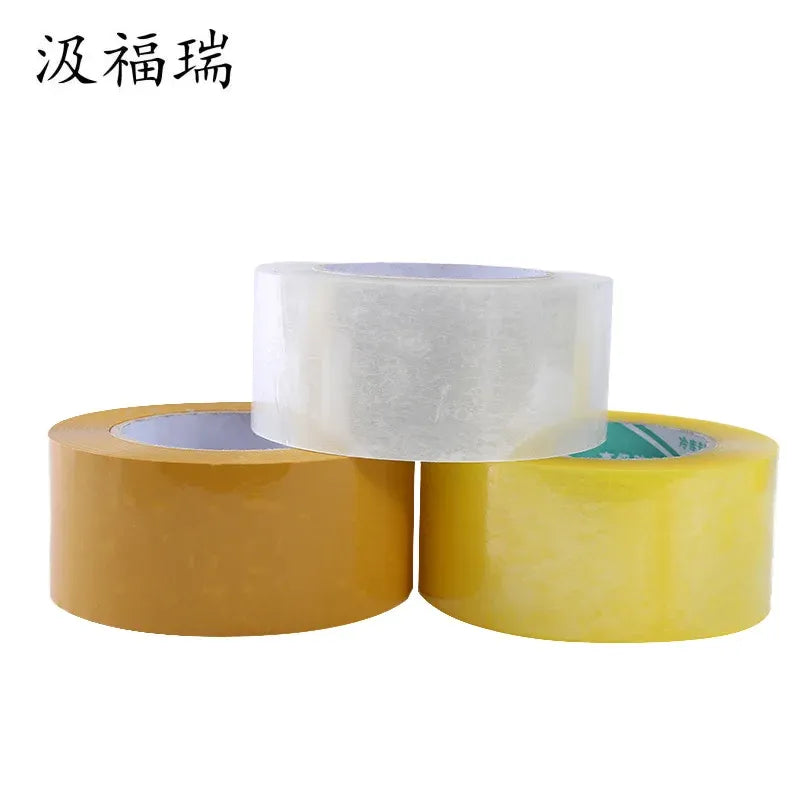 White and yellow adhesive tape rolls stacked for packaging and sealing