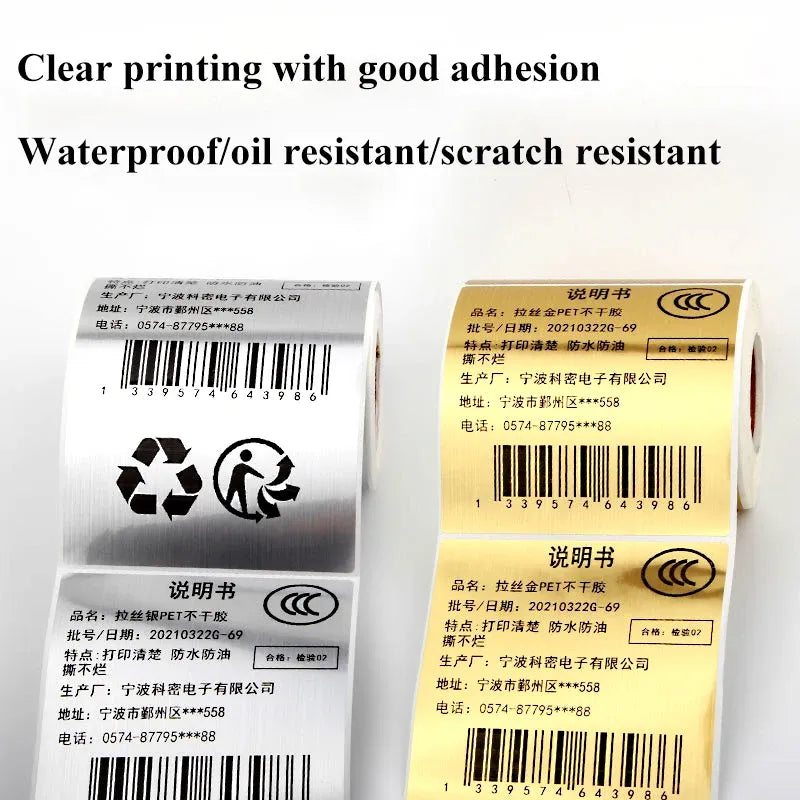 Silver and gold adhesive label rolls with barcode and recycle icons