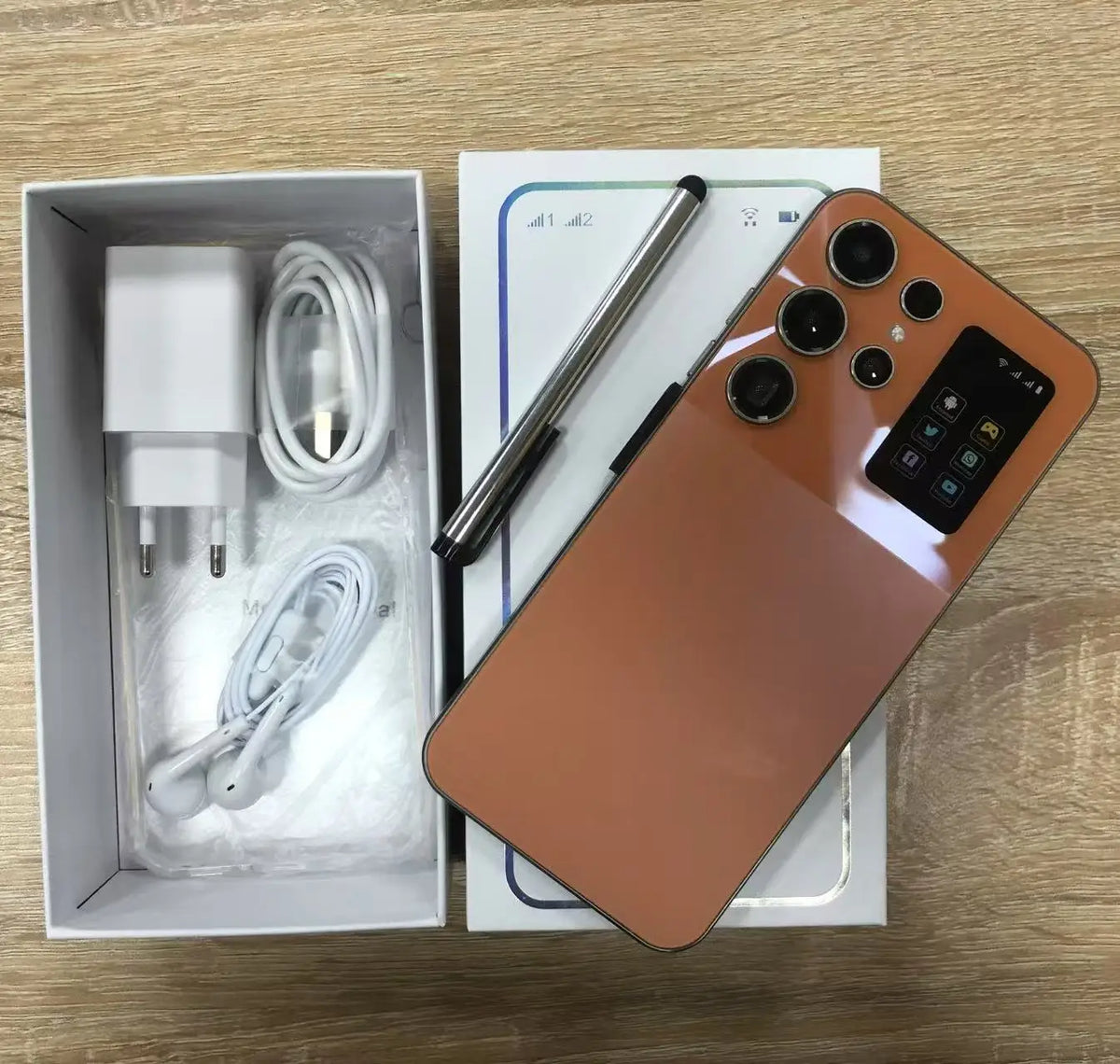 Orange smartphone with box and bundled charging cable