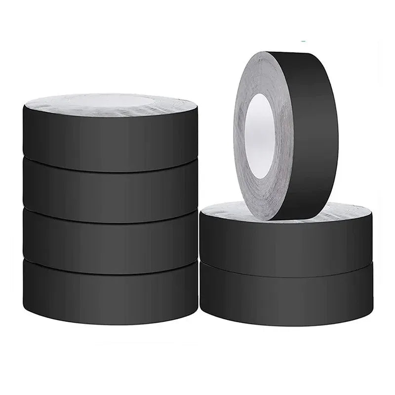 Black adhesive butyl tape rolls with visible roll core and backing