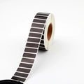 Black thermal label roll with rectangular labels on white backing