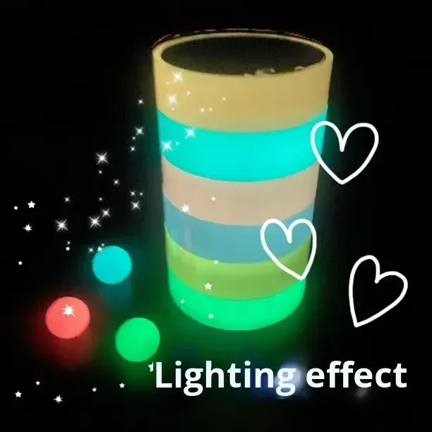 Glow-in-the-dark luminous tape rolls stacked, showing bright green and blue bands