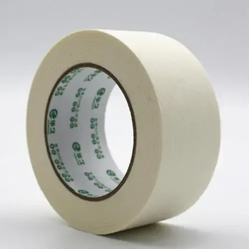 Light yellow masking tape roll with visible printed inner label on the core