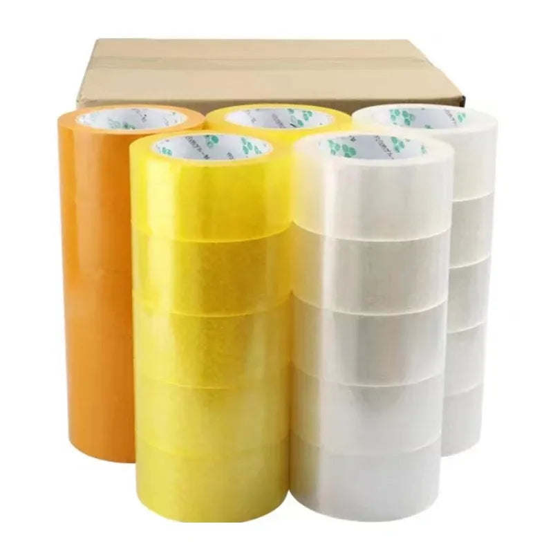 Assorted rolls of clear and yellow BOPP packaging tape stacked on a cardboard box