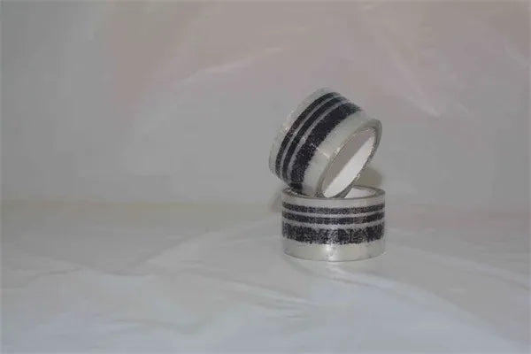 Black-and-silver striped packing tape roll, pressure-sensitive acrylic adhesive