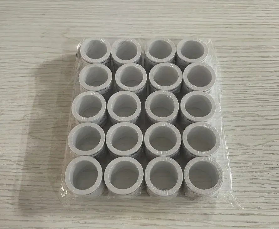 Clear tray with multiple circular self-adhesive stamps, gray backing