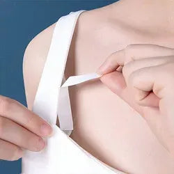 Transparent clothing tape strip being applied along a garment edge