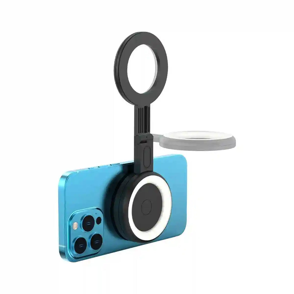 Black magnetic selfie ring light with folding extendable arm attached to the back of a blue smartphone.
