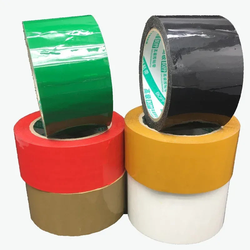 Colored acrylic carton sealing tape rolls in red, green, black, white, and yellow
