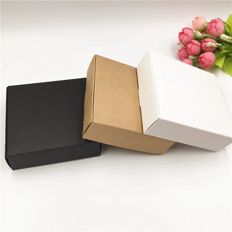 Kraft and black mailer boxes with white interior, opened lid; includes a white box