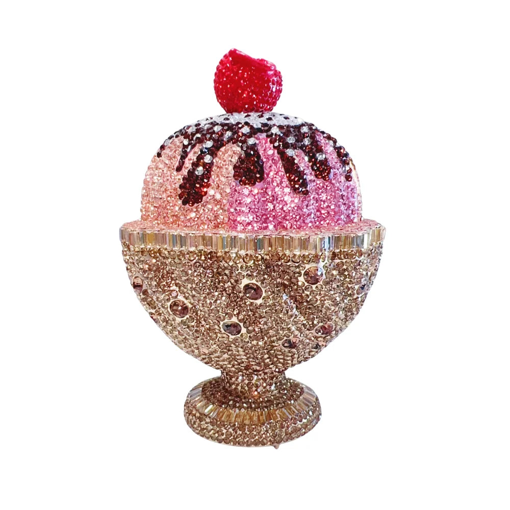 Crystal ice cream sundae clutch bag with pink, brown, and gold rhinestones and a red cherry topper. Designer handbag.