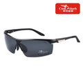 Black polarized sports sunglasses with semi-rimless frames, designed for outdoor activities and eye protection.