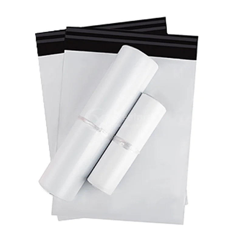 White poly mailer shipping bags with black top edges, rolled and stacked