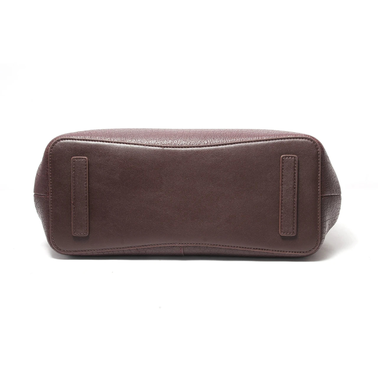 Bottom view of dark brown genuine leather designer handbag with protective feet and textured base.