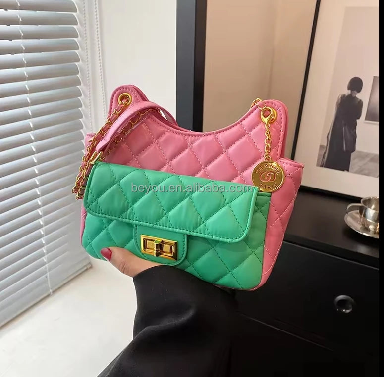 Pink and green quilted designer handbag with gold chain strap, metal lock closure, and luxury crossbody style.