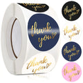 Roll of round adhesive stickers with “thank you” text in dark blue and pink tones
