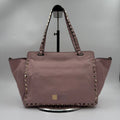 Second-hand pale pink genuine leather designer shoulder bag with gold pyramid rivet trim and dual carry straps.